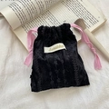 Detail of a black textured velvet drawstring pouch with pink silk ribbons and brand label - Pink Drawstring / Black