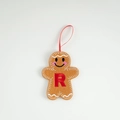 Felt gingerbread man ornament featuring white stitching and an embroidered red letter R - Letter R