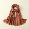 Terracotta red cotton linen scarf with fringe edges hanging on a neutral background - 100*195CM / Rust red
