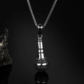 Detailed close-up of a black hip-hop microphone pendant with a twisted metal rope chain - Steel Color Black Zirconia With Chain