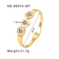 Detailed view of gold bangle showing 1.4cm shell discs with heart-shaped cubic zirconia - Gold/White