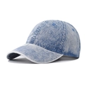Detail of washed denim baseball cap featuring vintage faded texture and precise stitching - Light Wash Denim Blue