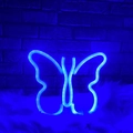 Blue LED butterfly neon light decoration on white fur against a dark brick wall - 1-2W / Butterfly Blue