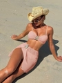 Detail of pink bikini with crystal teardrop buckles and ribbed fabric on a beach - S / Pink