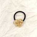 Elastic black hair tie with a textured golden heart-shaped metal accent on a white background - Gold Heart Pleated 3.5cm