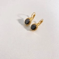 Detail of vintage gold earrings with oval black stones on textured white background - Gold & Black (DEK1282)