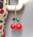 Detail of red cherry charm with rhinestone leaves and gold chain on a tumbler - Large Size Red