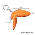 Realistic roasted chicken wing keychain toy in orange-yellow PVC, size 8cm and weight 44g - Light-colored Erlian Roasted Chicken Wings (keychain)