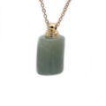 Detailed view of semi-precious green stone perfume bottle pendant with gold chain - Green Aventurine