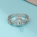 Whimsical frog ring in silver finish holding a sparkling round cubic zirconia stone - White K A-1358