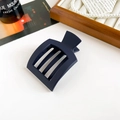 Close-up of matte navy blue square hair claw clip with hollow three-grid design - Matte Navy Blue