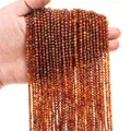 Macro shot of 3mm brown faceted natural stone round beads held in hand for jewelry making - 3mm (38cm, Approx. 120 Beads) / Orange Garnet