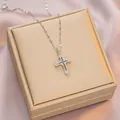 Silver titanium steel cross necklace with black diamonds on a pink silk background - 6043 Cross Black White Zircon / Silver