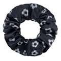 Detail view of black elastic hair scrunchie with printed white soccer ball patterns - Soccer Black