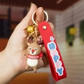 Cartoon reindeer Christmas keychain with a red silicone strap and a golden bell charm - Cute Reindeer White