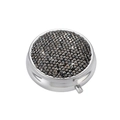 Detail of round silver pill box with shimmering black rhinestones and side push-button latch - Bright Black