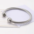 Silver twisted cable wire bracelet with birthstone and polished steel finishes - August / Peridot Green