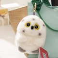 Cute white owl plush keychain with yellow eyes on a canvas bag pendant accessory - Owl
