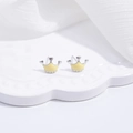 Detail of small crown stud earrings with silver metal and yellow enamel on ceramic plate - Yellow Crown