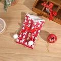 Knitted Christmas wine bottle cover with festive red tree patterns and pom-poms - Style 1 (Red White Christmas Tree)