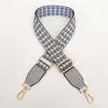 Close-up of gray houndstooth bag strap with adjustable gold buckle and leather accents - Grey + Grey Leather + Gold Hook