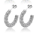 Detailed close-up of silver C-shaped earrings with rows of sparkling white zircons - 18K Gold / Steel With White Zirconia
