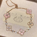 Rose gold clover bracelet with pink enamel and crystals featuring an adjustable pull chain - Rose Gold/Pink