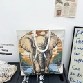 Cream canvas tote bag with sunset elephant embroidery and thick white rope handles - Morning Glow Elephant
