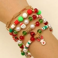 Dettaglio del set di braccialetti natalizi con ciondoli Babbo Natale e renna al polso - Babbo Natale 6 Pezzi (15)