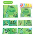Detail of green soft cloth book showing animals and objects for sensory baby learning - Green Series