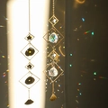 Set of 2 golden star suncatchers with crystal balls creating rainbow light effects - Design No.6
