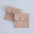 Two beige velvet jewelry pouches with flap and snap button closure for ring storage - Nude Pink