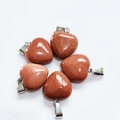Five 15mm red-brown heart-shaped goldstone pendants with silver bails on white backdrop - Synthetic Gold Sandstone