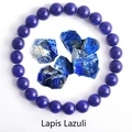 Natural Lapis Lazuli beaded elastic bracelet with raw gemstones on white background - Lapis Lazuli