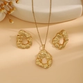 Detailed view of luxury gold jewelry set with irregular leaf textures on beige background - Hollow Ripple Style (E6210-20)
