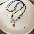 Collar de cuentas florales con colgante de caqui rojo y etiqueta de bendición - Estilo de borla de flor de cerámica
