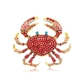Gold crab brooch featuring vibrant red, pink, and blue rhinestones with mirror reflection - Red