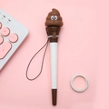 Creative stress-relief gel pen featuring a cute brown poop emoji silicone decoration - Poop Emoji Jumping Pen