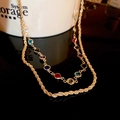 Double-layered golden necklace with colorful round zircons and twisted rope chain design - Multi-color