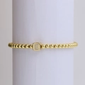 18k gold plated beaded bracelet featuring a cubic letter E pendant with zircon stones - Letter E
