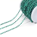 Green faceted crystal bead chain with gold wire winding on a white display spool - Green/3mm/02
