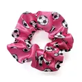 Detail of a bright pink satin scrunchie with classic soccer ball patterns and smooth texture - Rose Red