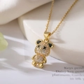 Macro shot of gold bear pendant with pavé cubic zirconia and black X-eye detail - Gold Pavé Bear