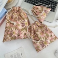 Three-piece drawstring pouch set with purple daisy floral prints on green linen fabric - Pink Daisy
