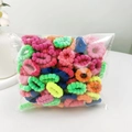 Macro shot of colorful plush hair ties showing elastic texture and soft cotton material - Fluorescent Neon