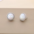 Detailed view of silver stud earrings with round white opal and beaded metal border - Steel Color Earrings (KE117752-GC)