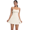 Detail of cream tennis dress featuring thin straps and stylish high side slit design - Light Ivory