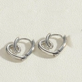 Polished silver heart-shaped hoop earrings with unique twisted metal design for women - Knot Heart Earrings / Platinum Color