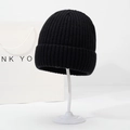 Classic black ribbed knit beanie with cuffed ear protection for winter outdoor warmth - Black
