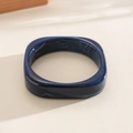 Detail view of dark blue resin bangle featuring white marble swirls and a square design. - Square Marbling (Blue) / Blue
